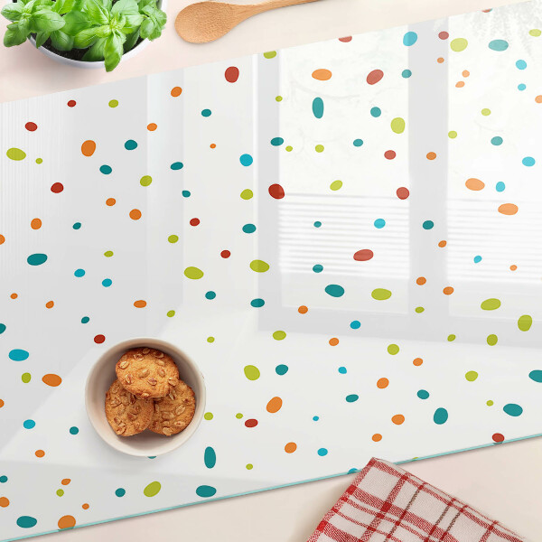 Tabla de cocina Puntos de colores sobre un fondo blanco