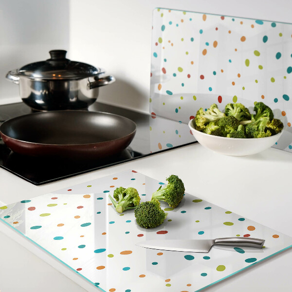 Tabla de cocina Puntos de colores sobre un fondo blanco