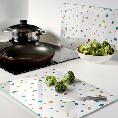 Tabla de cocina Puntos de colores sobre un fondo blanco