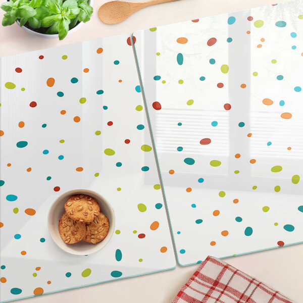 Tabla de cocina Puntos de colores sobre un fondo blanco