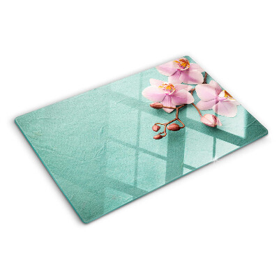 Tabla de cortar Orquídeas sobre fondo azul