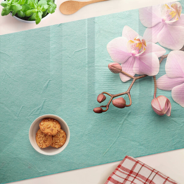 Tabla de cortar Orquídeas sobre fondo azul