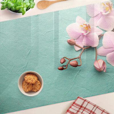 Tabla de cortar Orquídeas sobre fondo azul