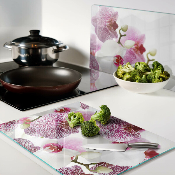 Szklana deska do krojenia Orchidee na tle okna