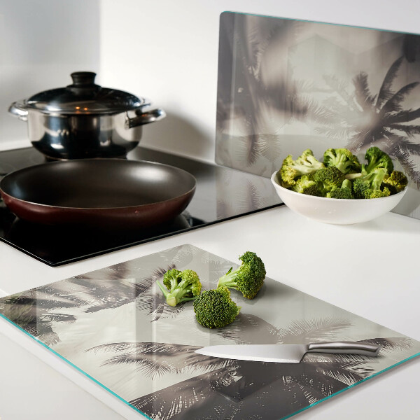 Tabla de cortar de cristal Palmeras sobre un fondo monocromático