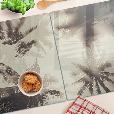 Tabla de cortar de cristal Palmeras sobre un fondo monocromático