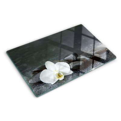 Tabla de cocina Flor de orquídea sobre piedras