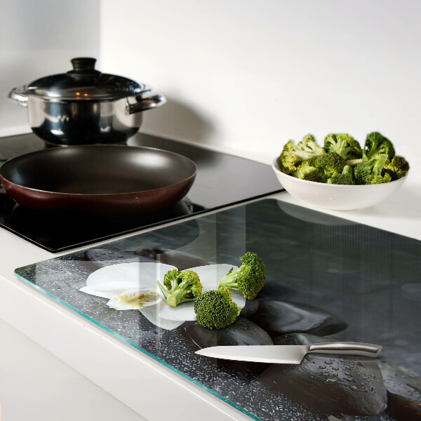 Tabla de cocina Flor de orquídea sobre piedras