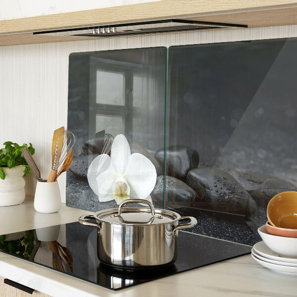 Tabla de cocina Flor de orquídea sobre piedras