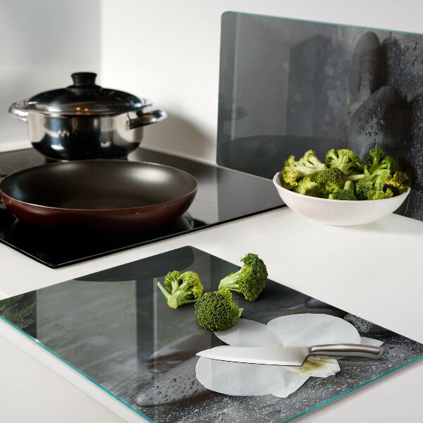 Tabla de cocina Flor de orquídea sobre piedras