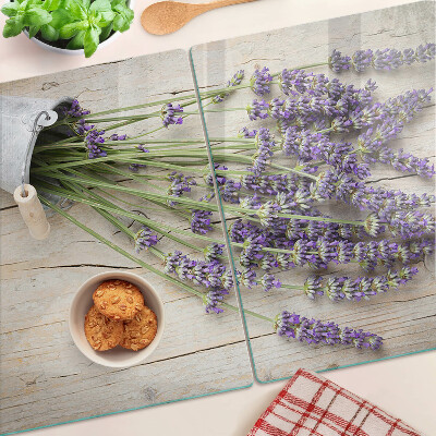 Tabla de cortar de cristal Lavanda en una maceta sobre un fondo de madera