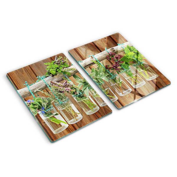 Szklana deska kuchenna Zioła w słoikach na tle drewna