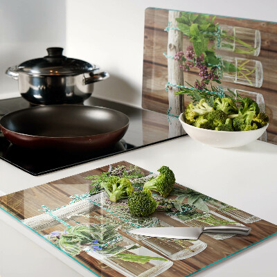 Szklana deska kuchenna Zioła w słoikach na tle drewna