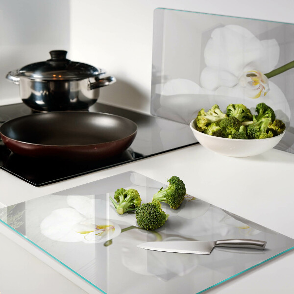 Tabla de cortar Orquídeas sobre un fondo de espejo