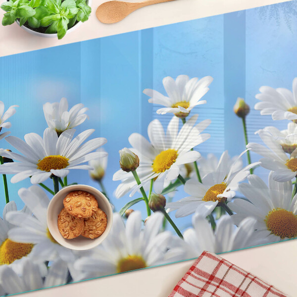 Tabla de cocina Flores de margarita sobre un fondo azul