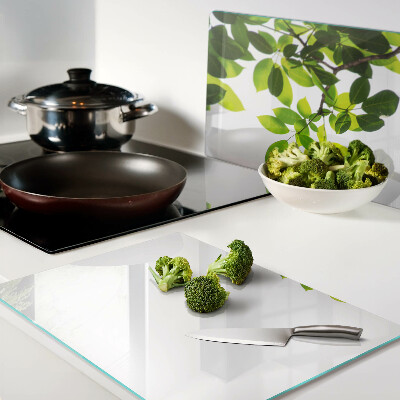 Szklana deska do krojenia Liście na tle jasnego nieba