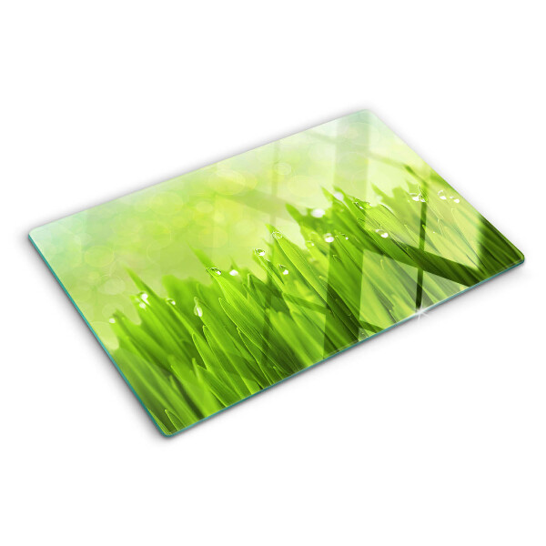 Tabla para cortar Hierba verde con gotas de agua