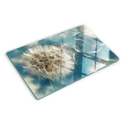 Tabla de cortar Dientes de león contra el cielo