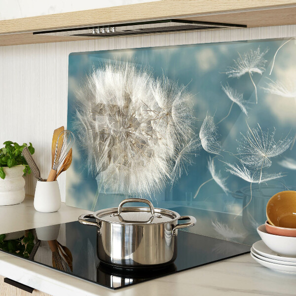 Tabla de cortar Dientes de león contra el cielo