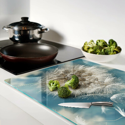 Tabla de cortar Dientes de león contra el cielo