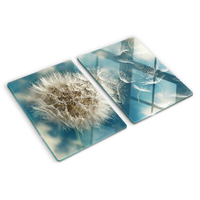 Tabla de cortar Dientes de león contra el cielo