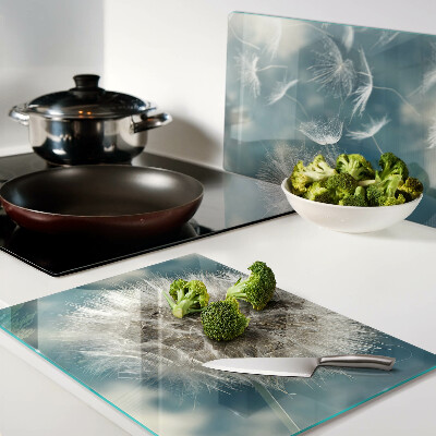 Tabla de cortar Dientes de león contra el cielo