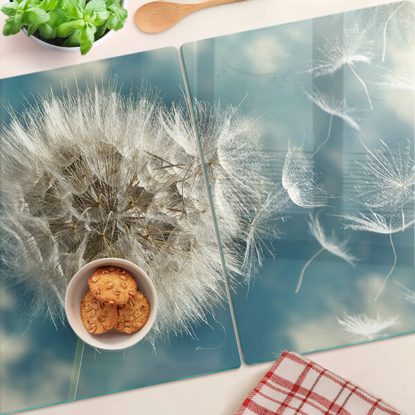 Tabla de cortar Dientes de león contra el cielo