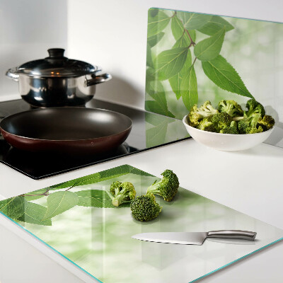 Szklana deska kuchenna Liście na tle rozmytej zieleni