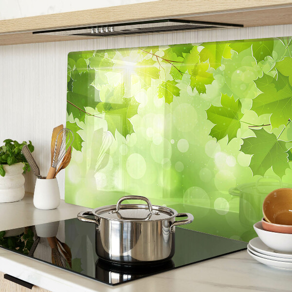 Tabla de cortar de cristal Hojas bajo los rayos del sol