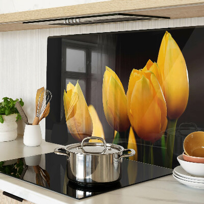 Tabla de cortar de cristal Tulipanes amarillos sobre fondo negro