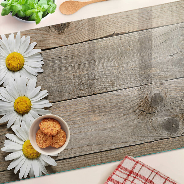 Tabla para cortar Flores sobre un fondo de madera