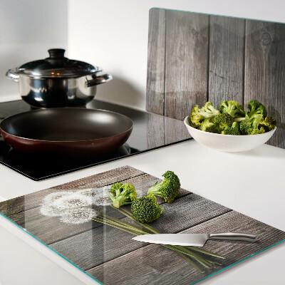 Szklana deska kuchenna Kwiaty dmuchawce na drewnianym tle