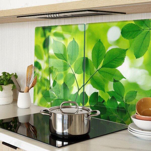 Deska kuchenna szklana Liście na zielonym tle
