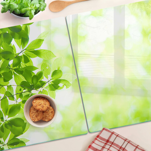 Tabla de cortar de cristal Hojas verdes a la luz