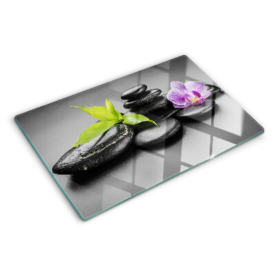 Deska kuchenna szklana Kamienie i orchidea na tle