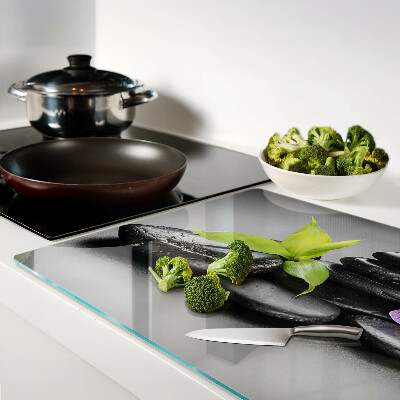 Tabla de cocina Piedras y orquídea al fondo.