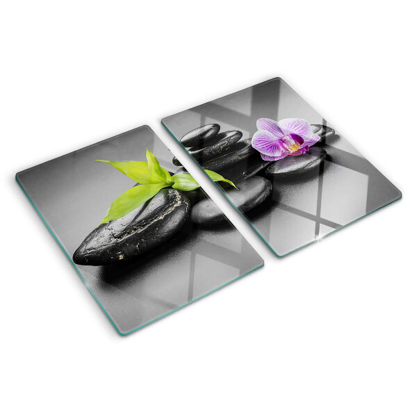 Tabla de cocina Piedras y orquídea al fondo.