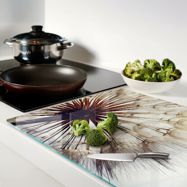 Tabla de cortar de cristal Dientes de león a la luz