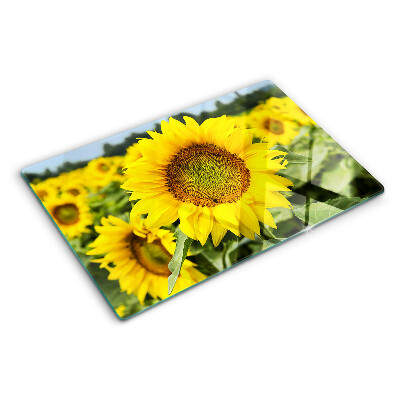 Tabla para cortar Girasoles sobre un fondo verde.