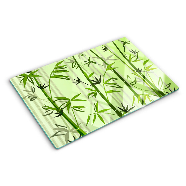 Tabla de cortar de cristal Bambú sobre un fondo verde