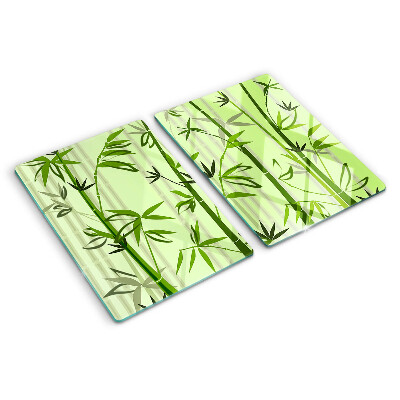 Tabla de cortar de cristal Bambú sobre un fondo verde