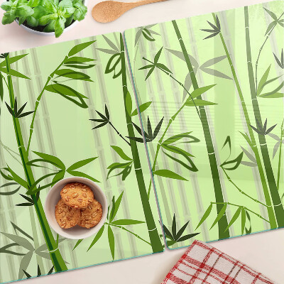 Tabla de cortar de cristal Bambú sobre un fondo verde