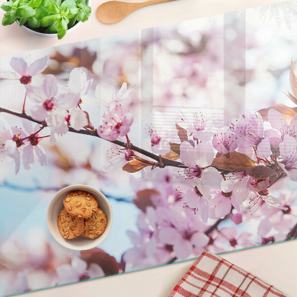 Deska kuchenna szklana Kwiaty wiśni na niebieskim tle