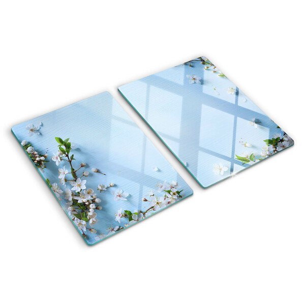 Tabla de cortar de cristal Patrón floral sobre fondo azul.