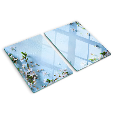 Tabla de cortar de cristal Patrón floral sobre fondo azul.