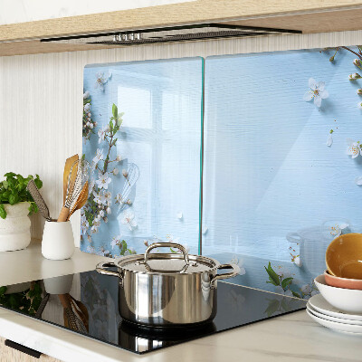 Tabla de cortar de cristal Patrón floral sobre fondo azul.