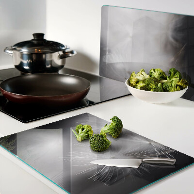 Szklana deska kuchenna Puszyste dmuchawce na tle okna