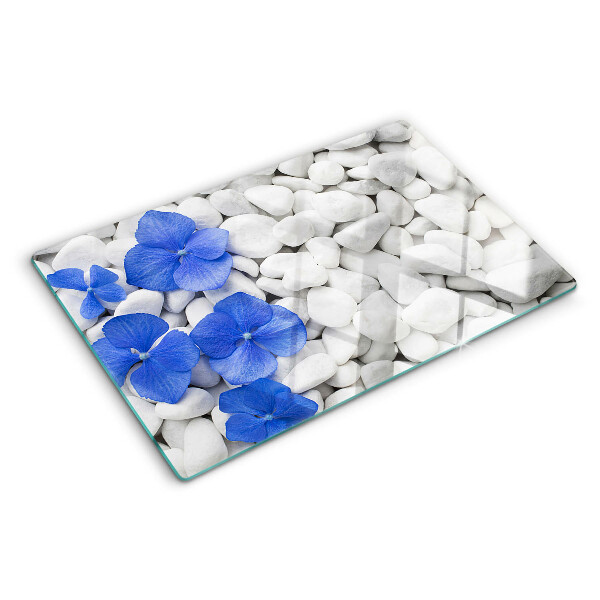 Tabla de cocina Flores azules sobre piedras blancas