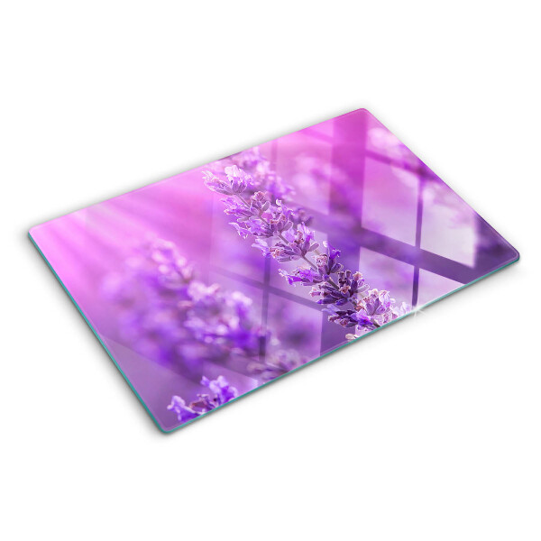 Tabla de cortar de cristal Flores de lavanda sobre un fondo morado.