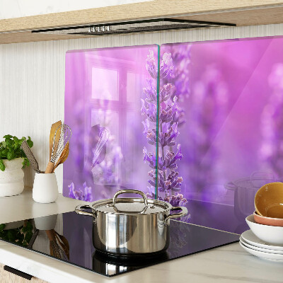 Tabla de cortar de cristal Flores de lavanda sobre un fondo morado.